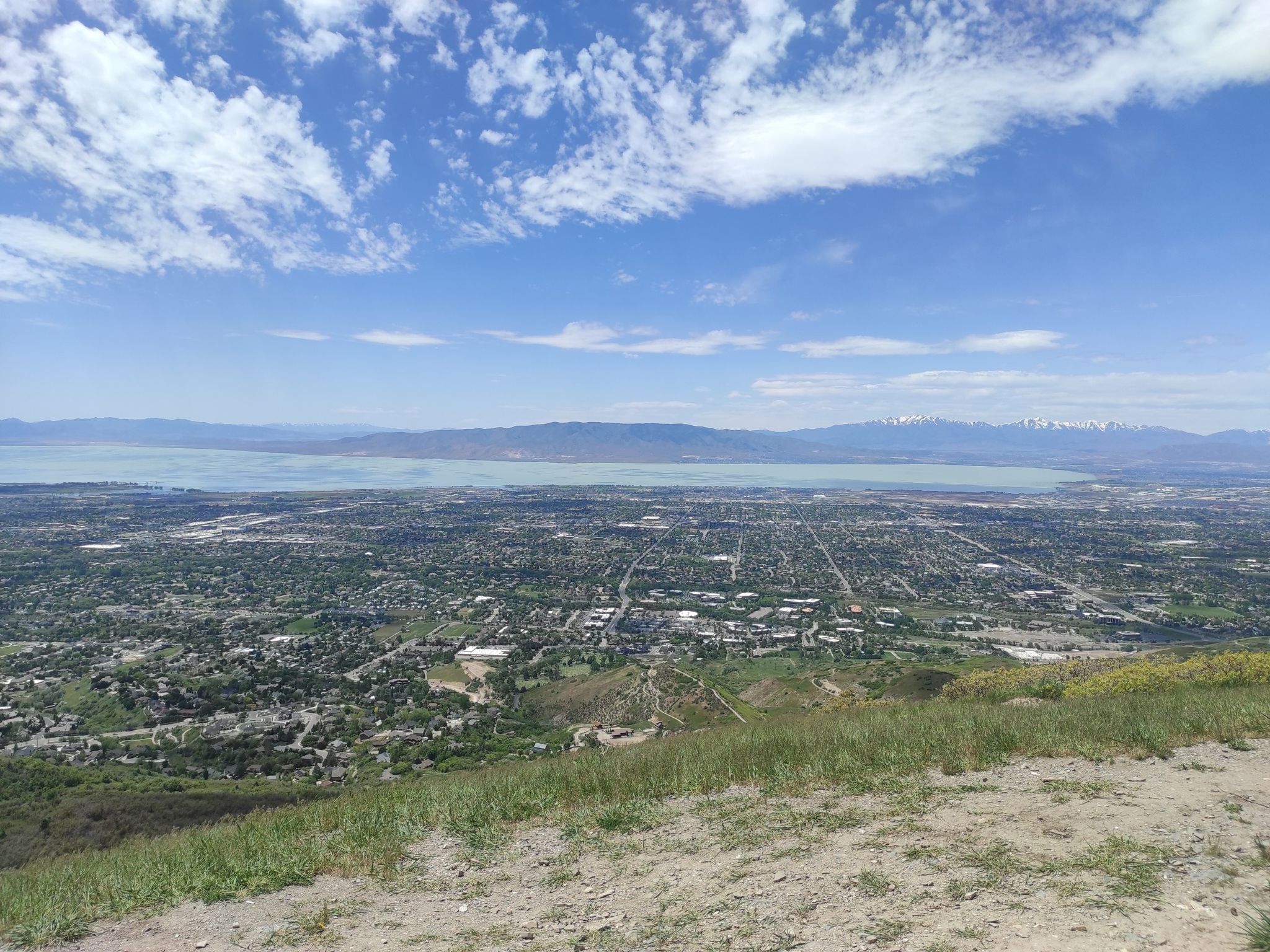 Overhead view of a city and large lake under a partly cloudy blue sky. - Provo River Parkway – KhPeak Overlook loop from Cascade Professional Plaza