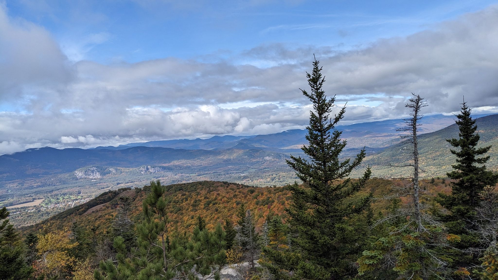 Panoramic view of autumn mountains and valley under a cloudy sky. - Black Cap Trail
