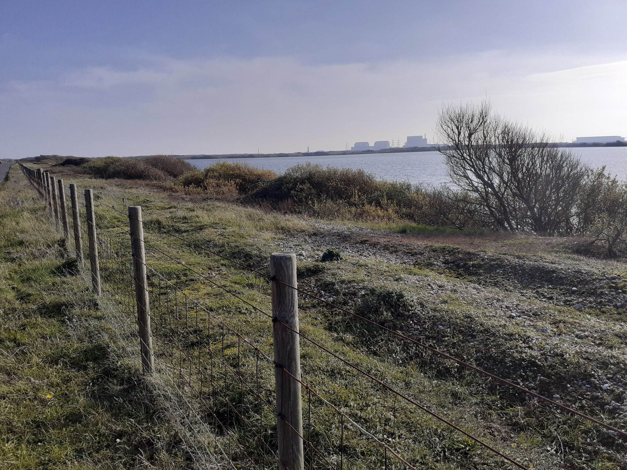 looking back to lighthouses and power station Dungeness 