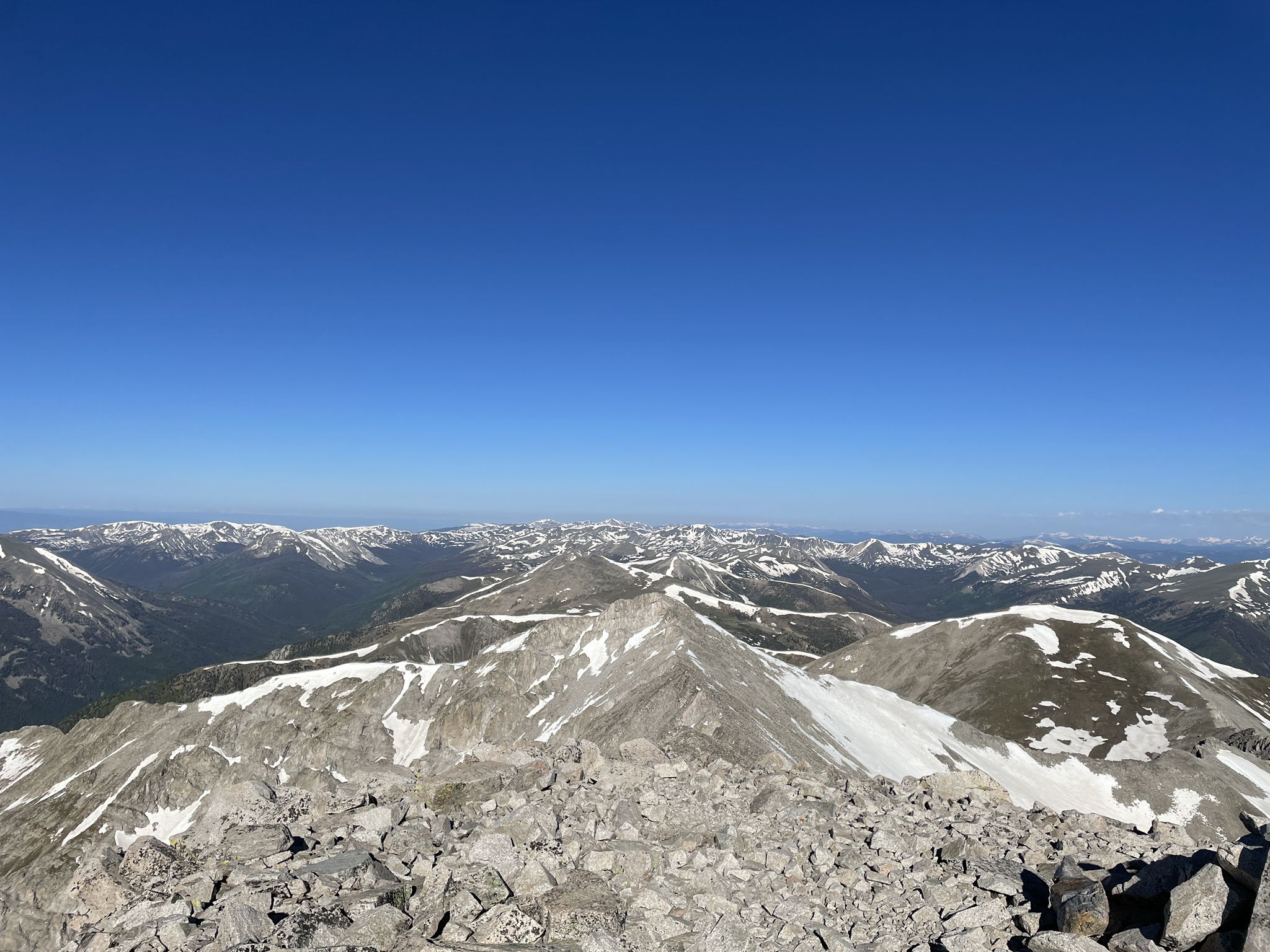 Panoramic view of snow-capped mountains and rocky peaks under a clear blue sky. - Mount Princeton Trail