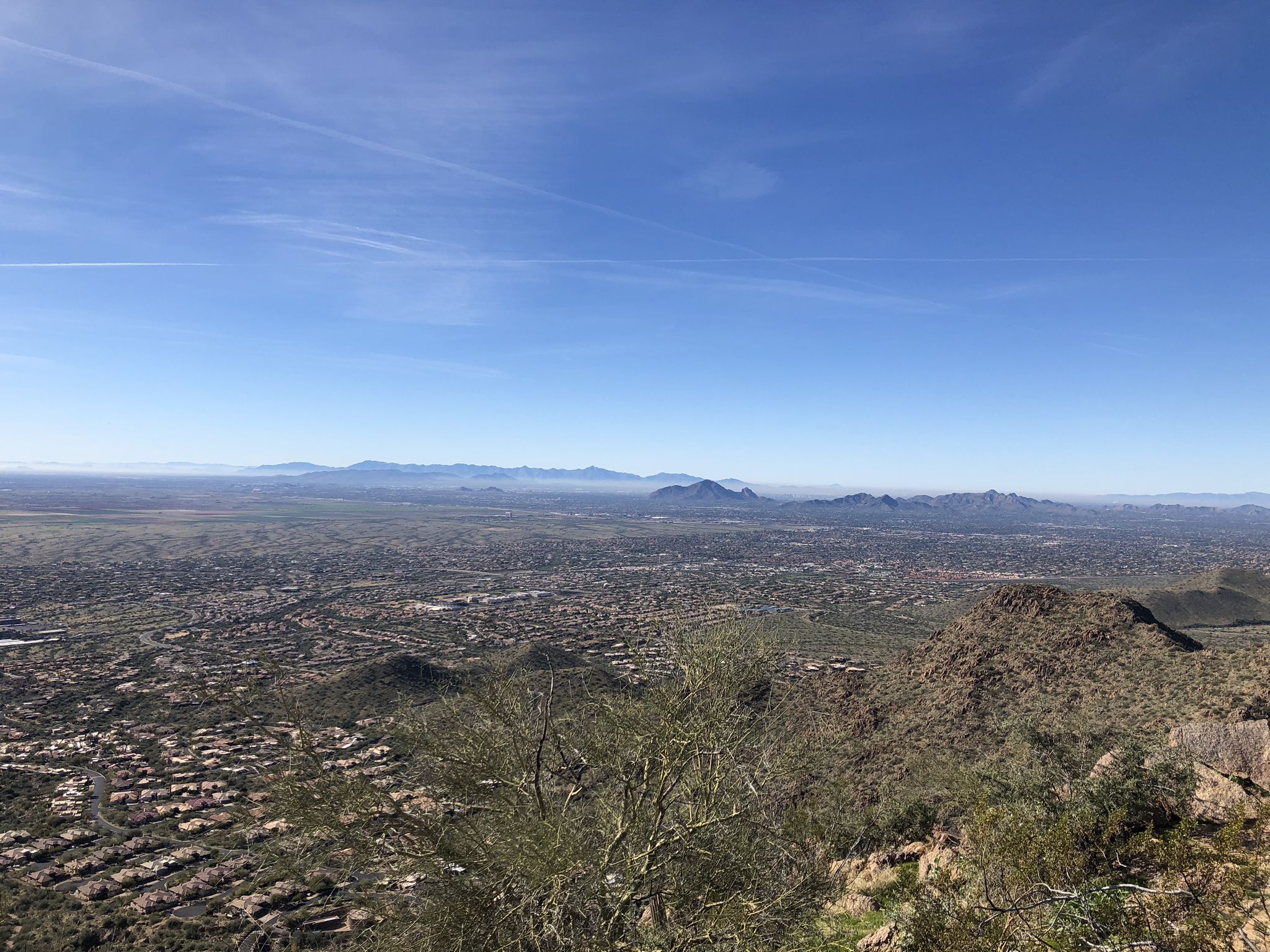 Expansive sunny view of a city and distant mountains under a clear blue sky. - Sunrise Trail to Sunrise Peak