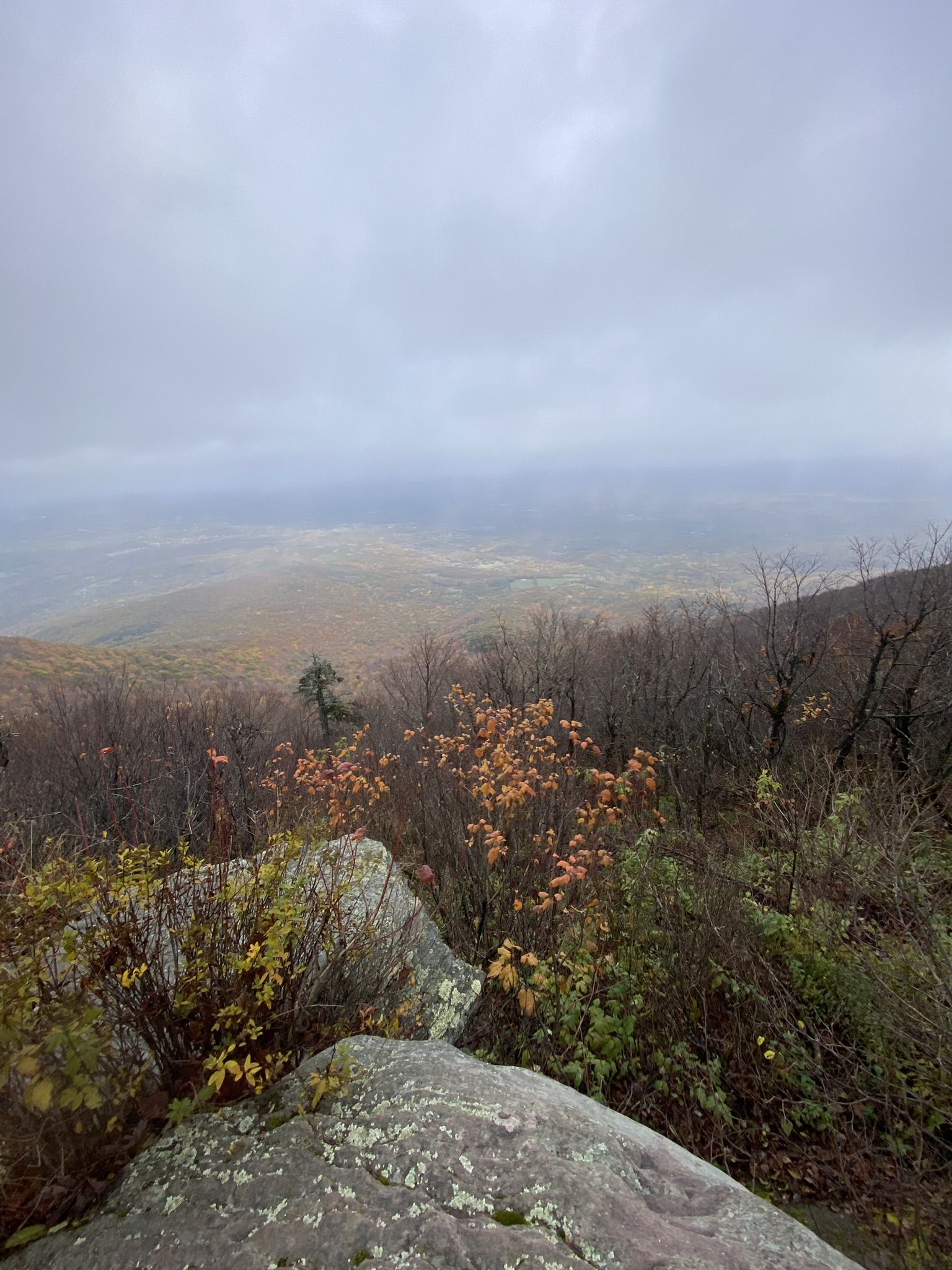 Cloudy overlook from a rocky cliff, with a distant, hazy valley. - Windham High Peak via Elm Ridge and Escarpment Trails