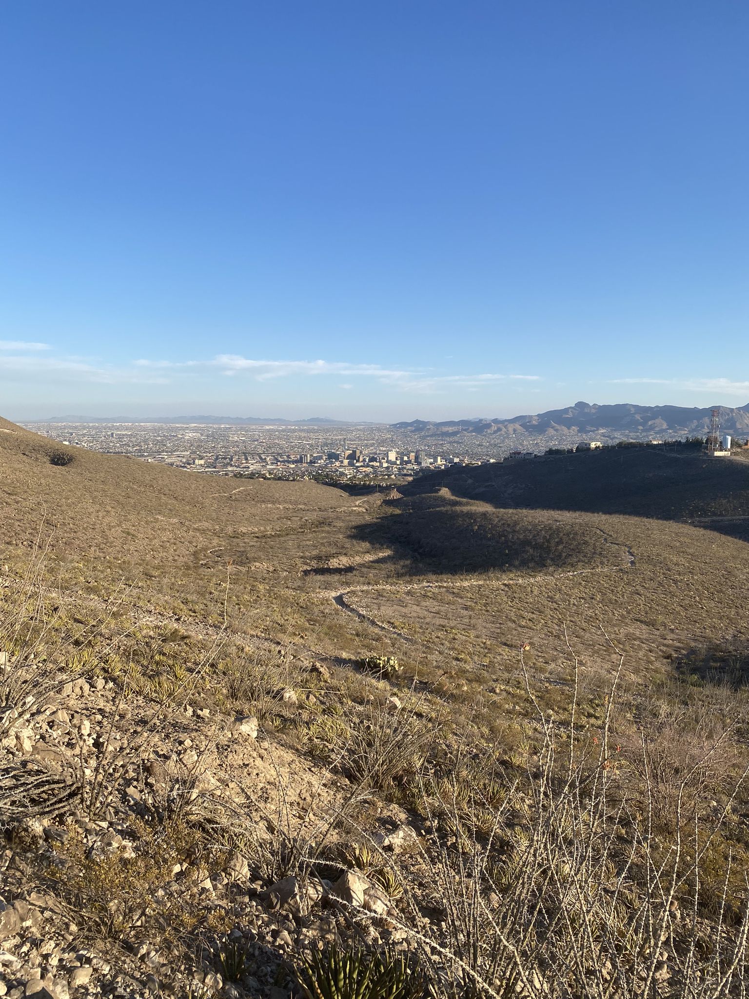 Panoramic view of a city in a valley surrounded by arid hills and mountains. - Thousand Steps and Monk's Trail Loop