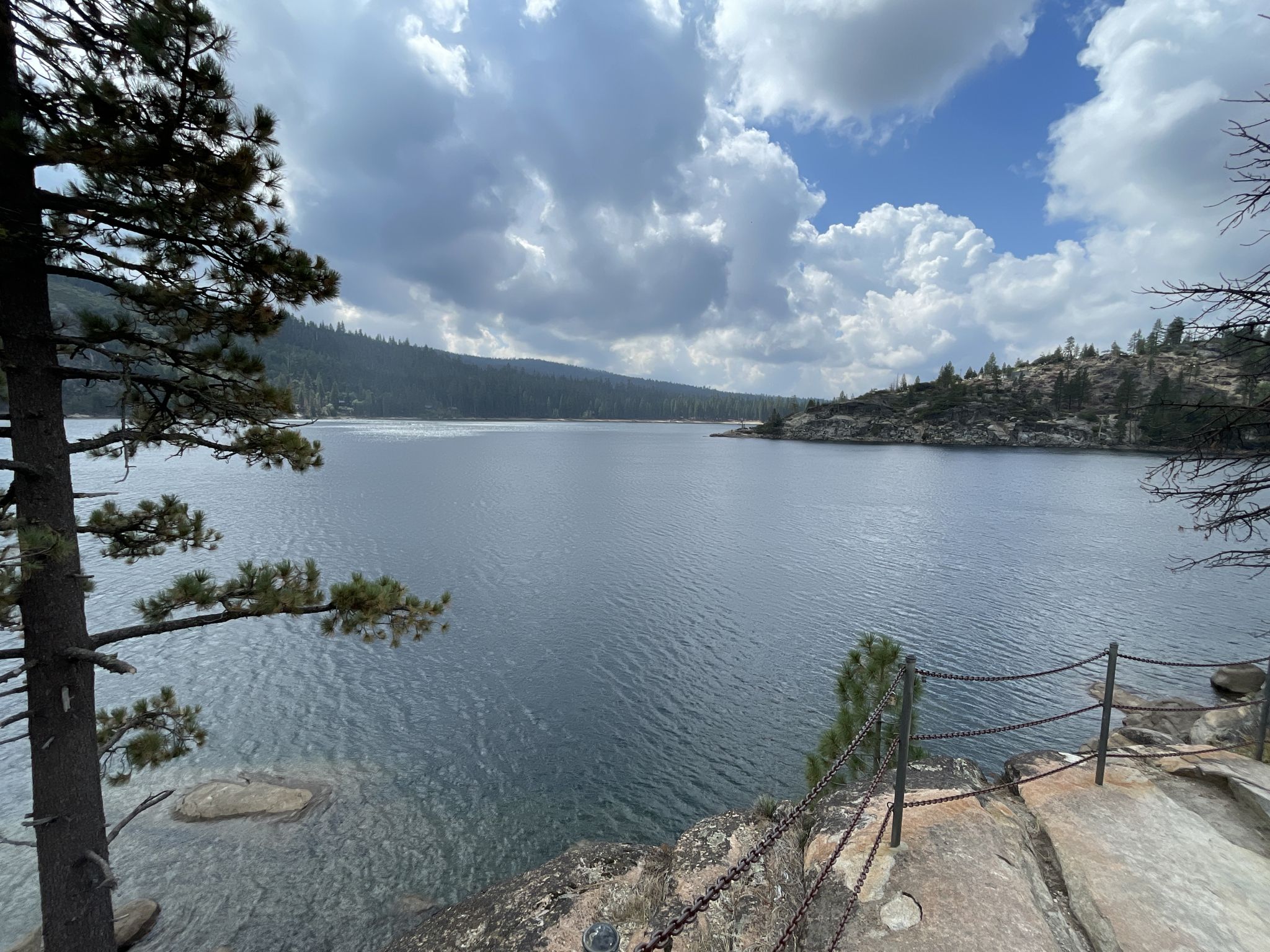 Large lake surrounded by forested hills under a cloudy sky. - Herring Creek and Pinecrest Lake Loop