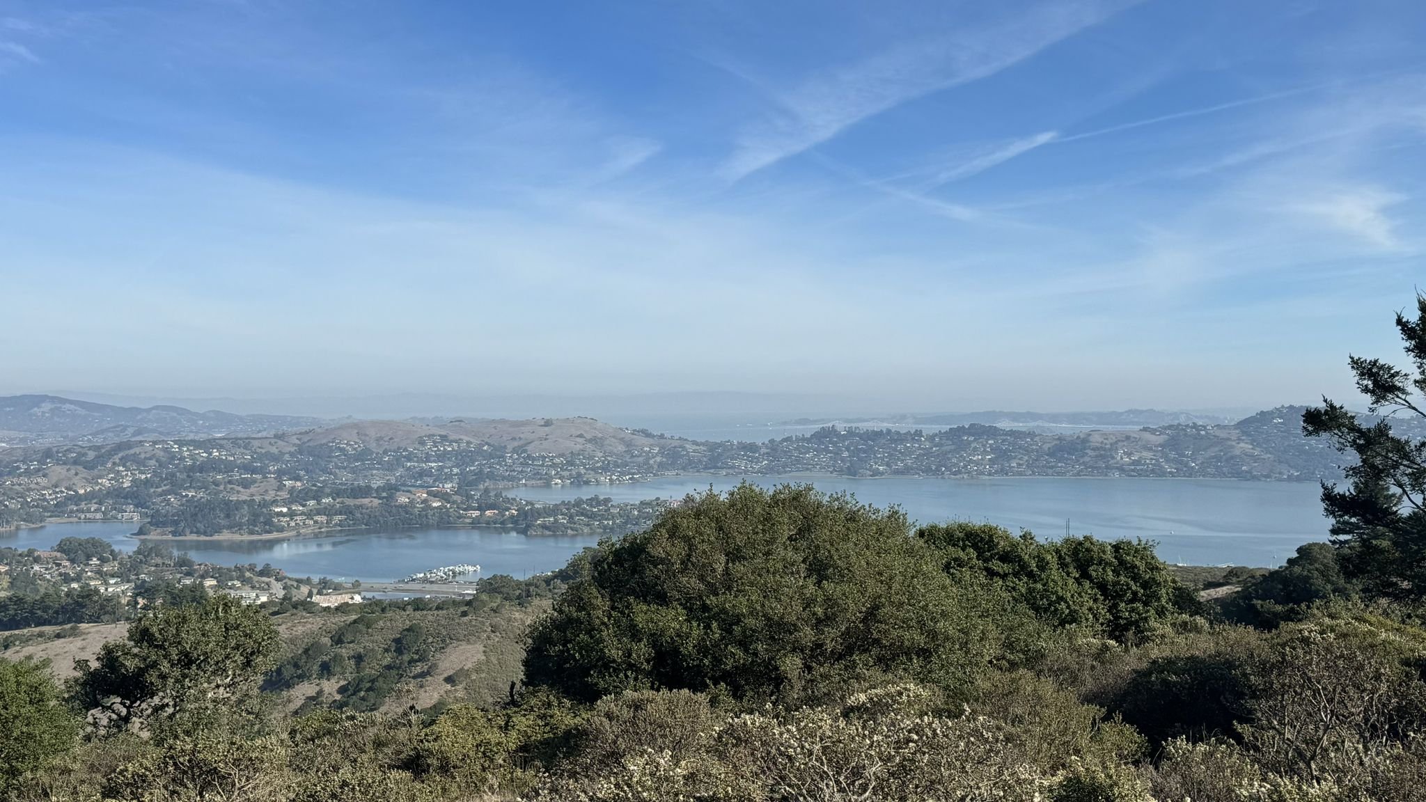 Panoramic view of a bay with boats, hills, and distant city under clear sky. - Marincello, Bobcat, Miwok and Old Springs Loop
