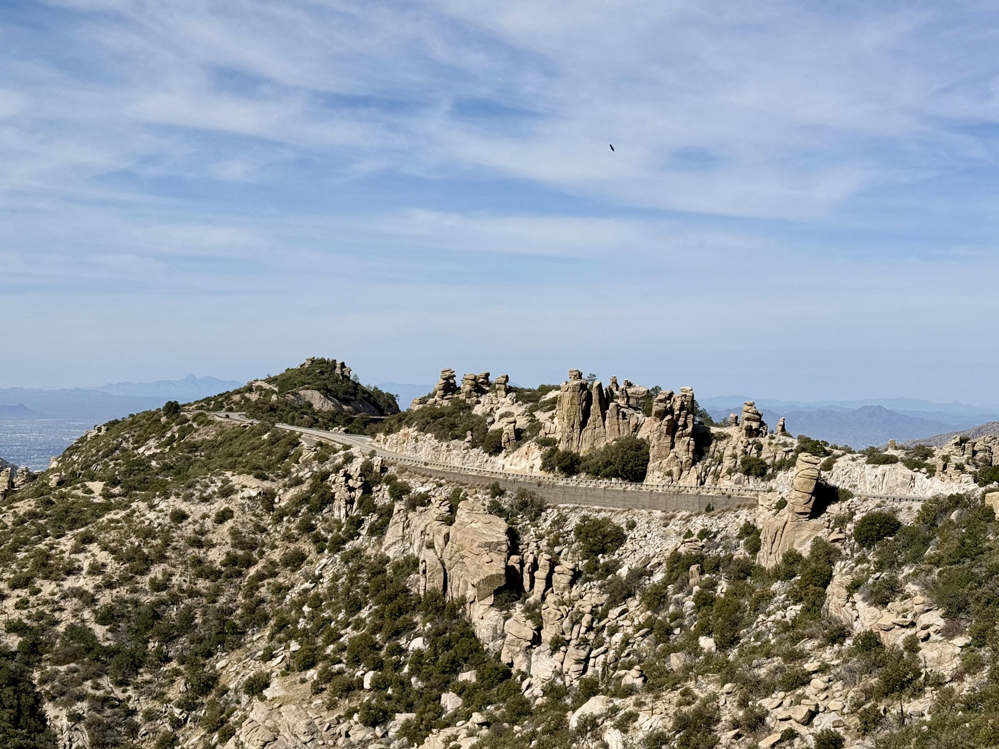 Winding mountain road with unique rock formations under a sunny sky. - Himmel Park – Babad Do'ag Vista Point loop from Tucson